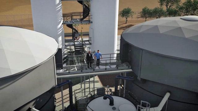 A video screenshot showing a 3D rendering of two people at a water treatement plant